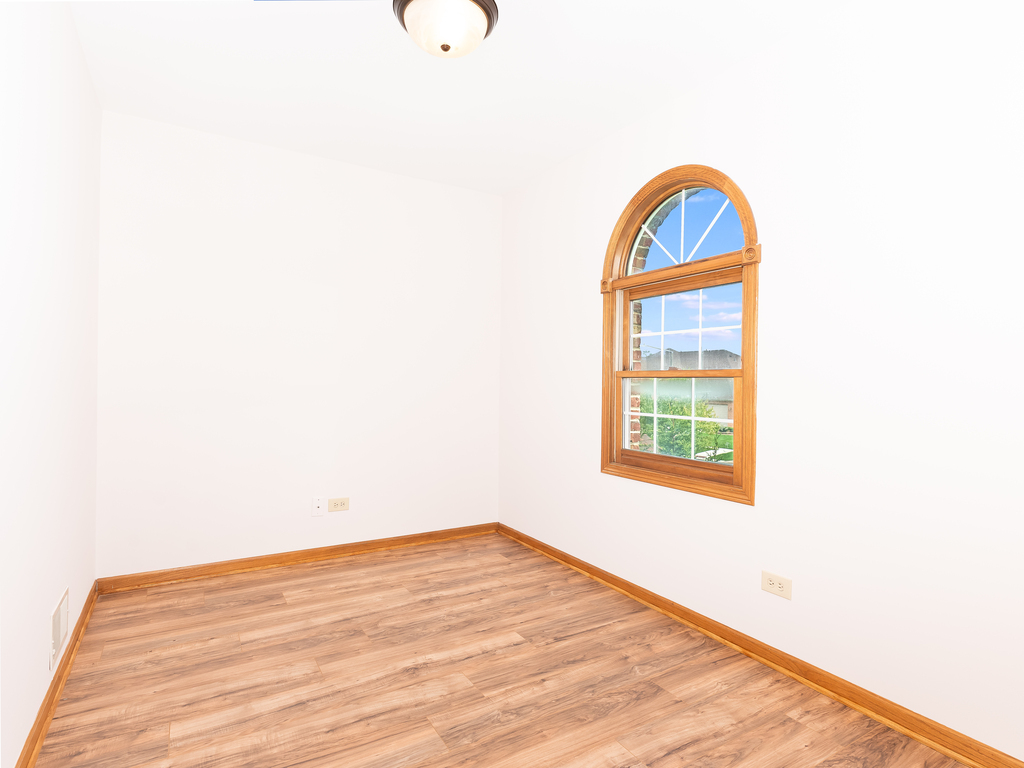 21322 Georgetown Road Frankfort, IL 60423 - Photo 19 of 28 a view of a room with wooden floor and a window