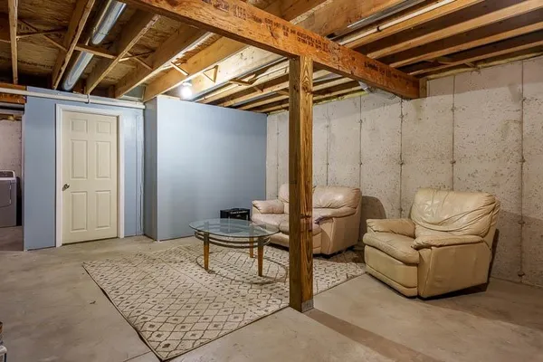 a living room with furniture and a rug