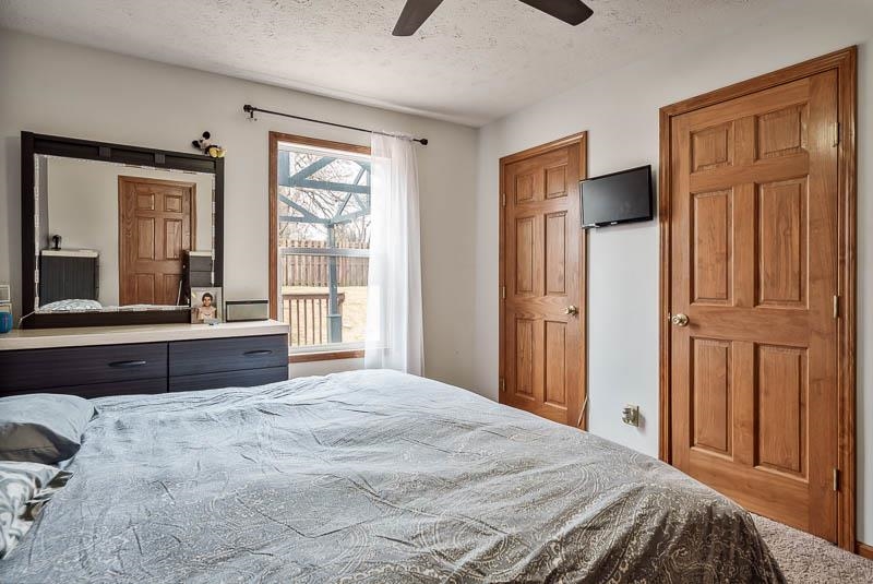 5094 Grand Cape Road Rockford, IL 61109 - Photo 17 of 30 a bedroom with a large bed and a large window