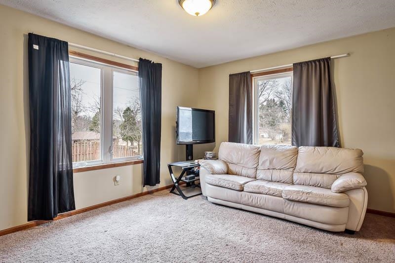 5094 Grand Cape Road Rockford, IL 61109 - Photo 19 of 30 a living room with furniture and a window