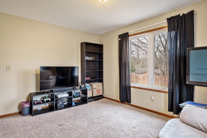 5094 Grand Cape Road Rockford, IL 61109 - Photo 20 of 30 a living room with furniture and a flat screen tv