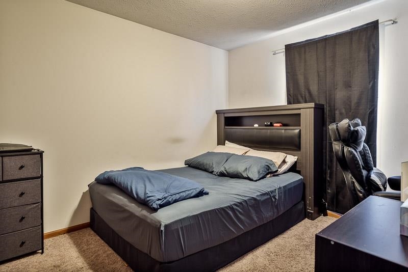 5094 Grand Cape Road Rockford, IL 61109 - Photo 21 of 30 a bedroom with a bed and a closet