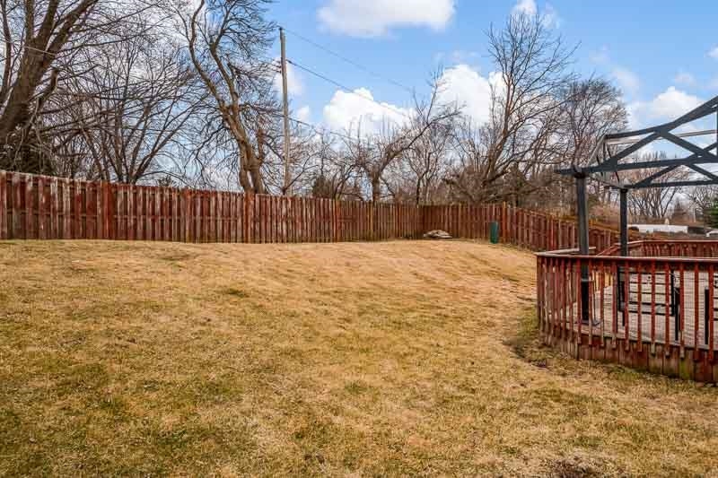 5094 Grand Cape Road Rockford, IL 61109 - Photo 27 of 30 a view of backyard with wooden fence