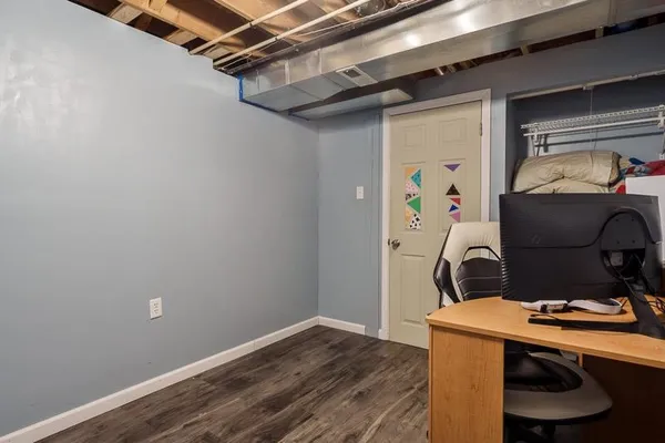 a room with a wooden floor and a table