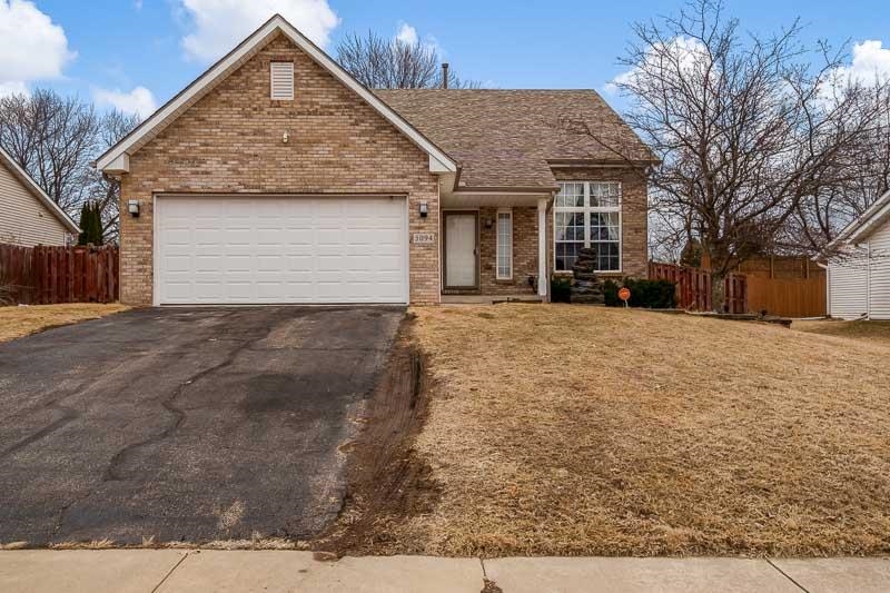 5094 Grand Cape Road Rockford, IL 61109 - Photo 6 of 30 a front view of a house with a yard