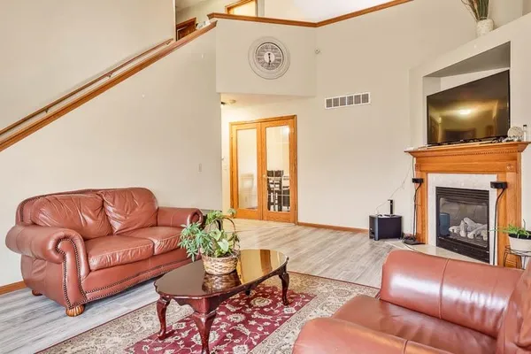 a living room with furniture and a fireplace