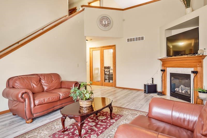 5094 Grand Cape Road Rockford, IL 61109 - Photo 9 of 30 a living room with furniture and a fireplace