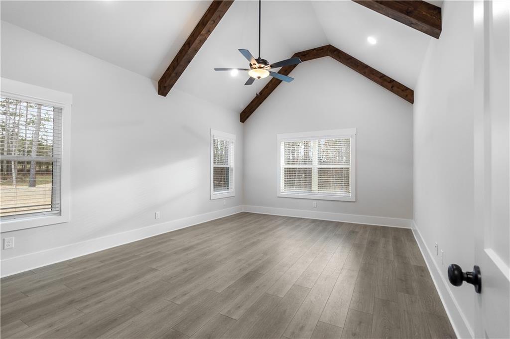 2321 Pebble Trail Monroe, GA 30656 - Photo 15 of 21 a view of an empty room with wooden floor and a window