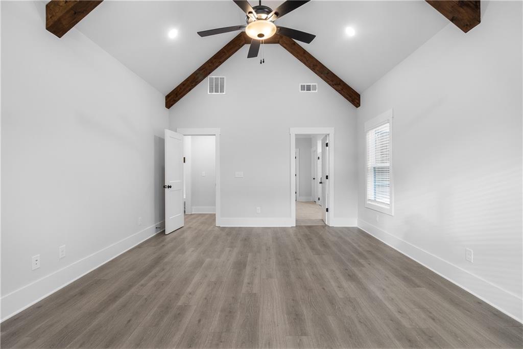 2321 Pebble Trail Monroe, GA 30656 - Photo 16 of 21 a view of an empty room with window and wooden floor