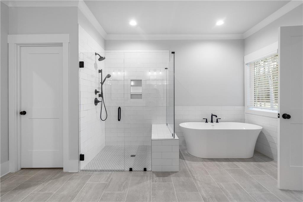2321 Pebble Trail Monroe, GA 30656 - Photo 20 of 21 a bathroom with a bathtub sink and shower