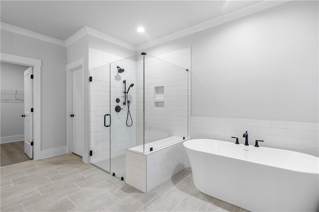 2321 Pebble Trail Monroe, GA 30656 - Photo 21 of 21 a bathroom with a bathtub and a shower