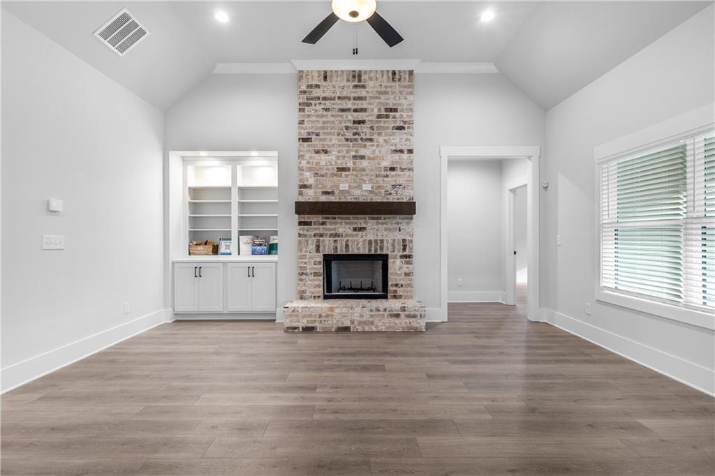 2321 Pebble Trail Monroe, GA 30656 - Photo 3 of 21 a view of an empty room with a fireplace and a window