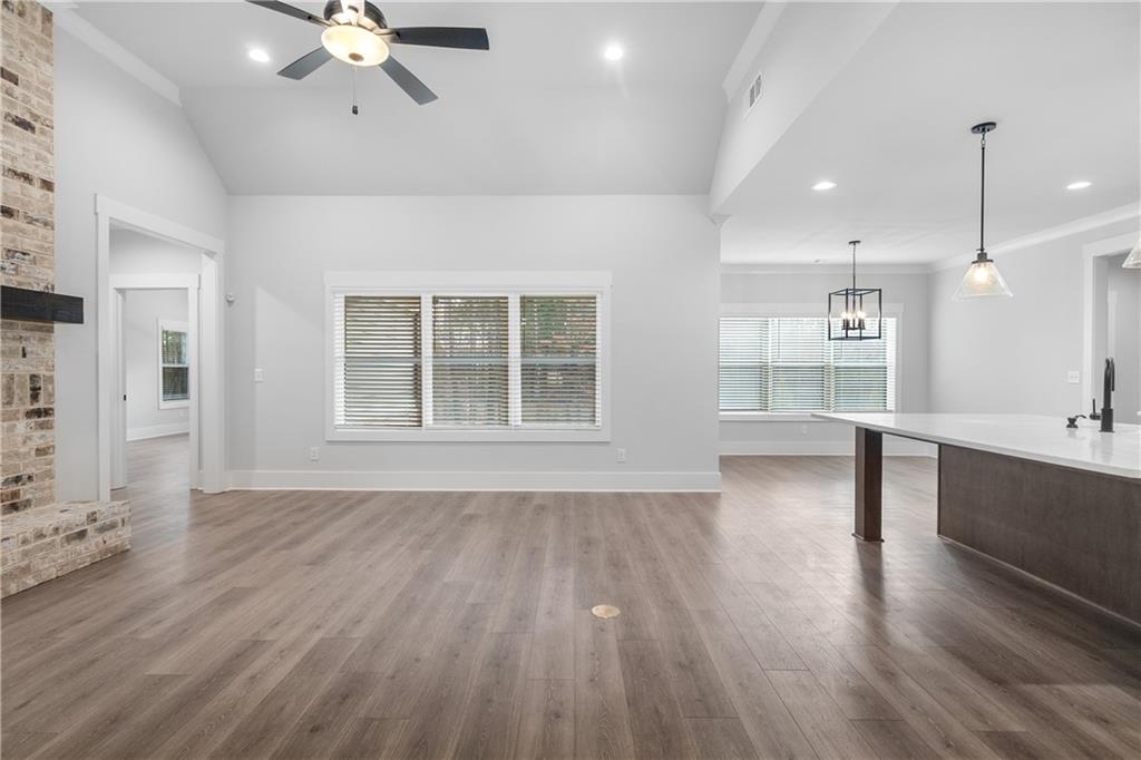 2321 Pebble Trail Monroe, GA 30656 - Photo 4 of 21 a view of an empty room with wooden floor and a window
