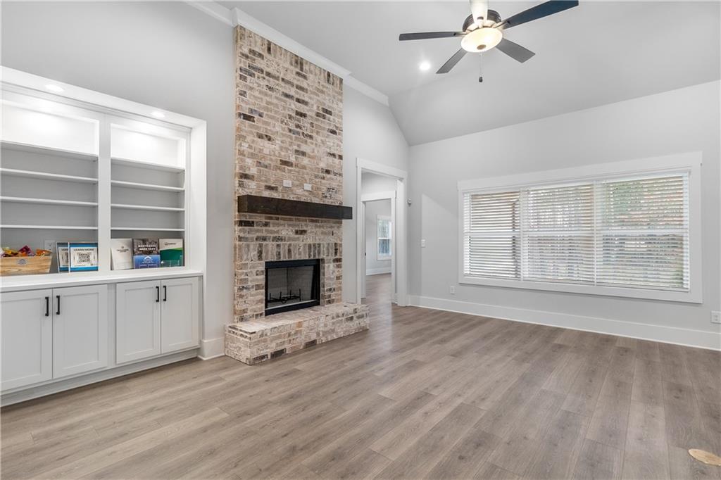 2321 Pebble Trail Monroe, GA 30656 - Photo 5 of 21 a view of an empty room with a window and fireplace