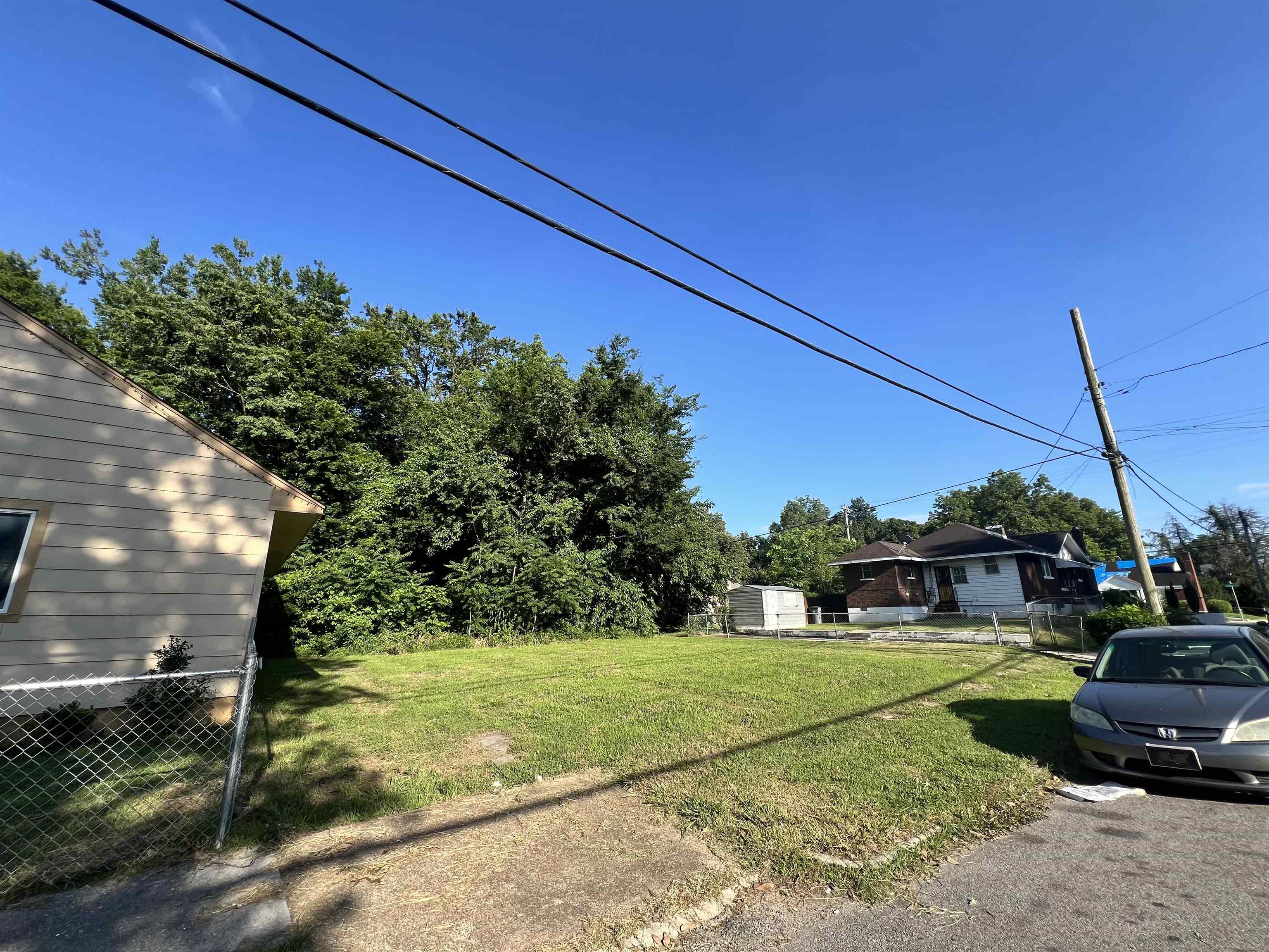 996 Rozelle Street Memphis, TN 38114 - Photo 3 of 4 a view of a house with a big yard