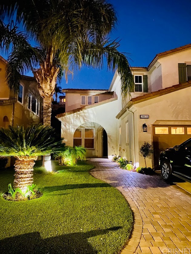 a front view of a house with swimming pool