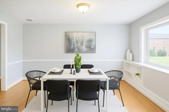 a view of a dining room with furniture and window