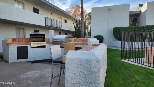 a table and chairs in front of a house