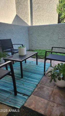 a view of a terrace with seating area