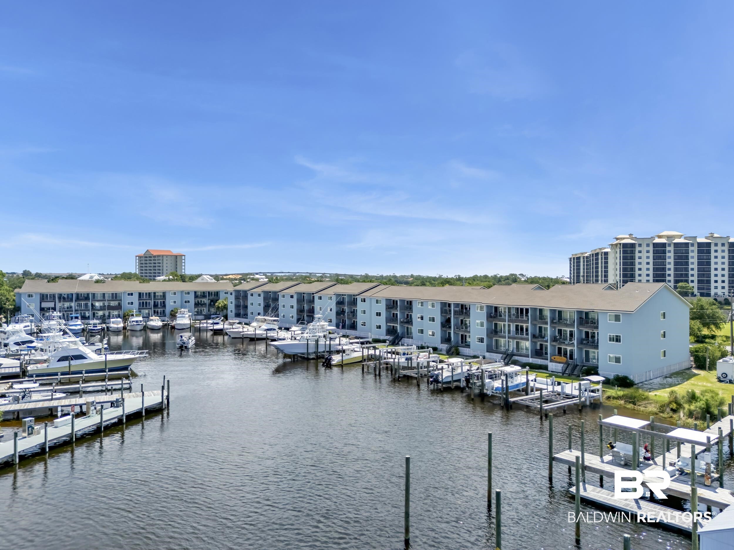 14100 River Road, Unit 211 Pensacola, FL 32507 - Photo 41 of 56 Waterfront property featuring multiple boat slips, private dock access, and a clear expanse of water