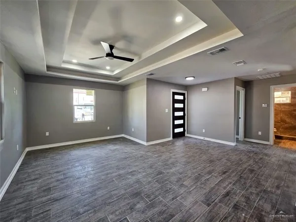 a view of an empty room with a window