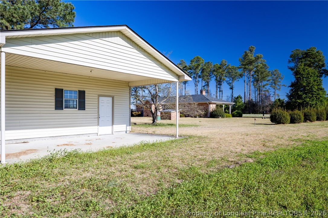 5424 Bonnetsville Road Clinton, NC 28328 - Photo 24 of 29 a view of a house with a yard and tree s