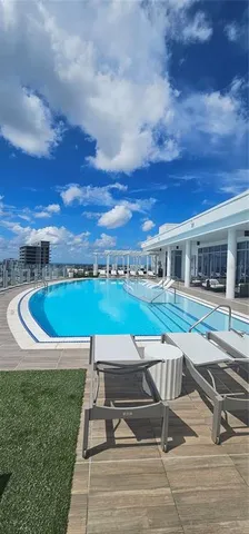 an outdoor living room with furniture