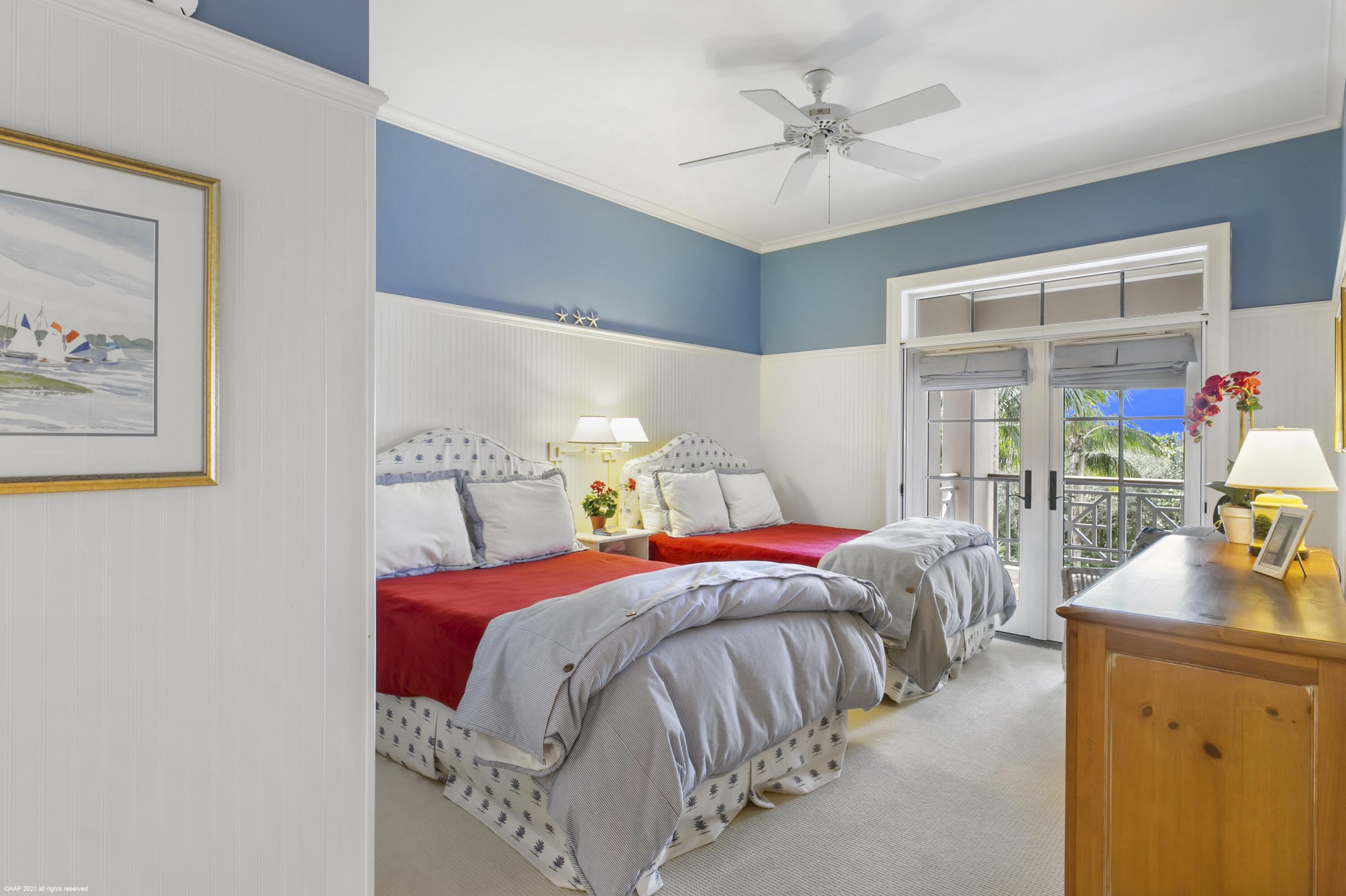 60 Beachside Drive, Unit 201 Orchid, FL 32963 - Photo 12 of 23 a bedroom with a bed and a chandelier