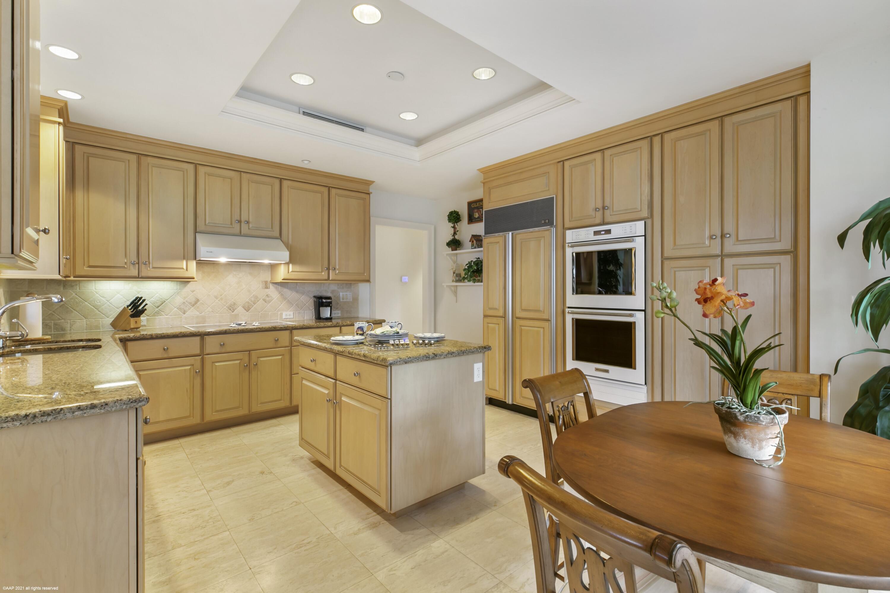 60 Beachside Drive, Unit 201 Orchid, FL 32963 - Photo 14 of 23 a kitchen with stainless steel appliances granite countertop a stove refrigerator sink and cabinets