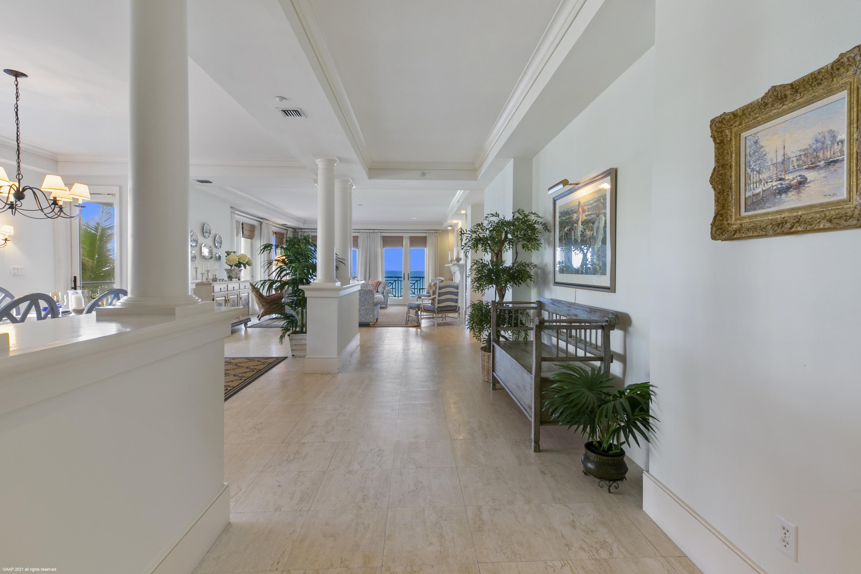 60 Beachside Drive, Unit 201 Orchid, FL 32963 - Photo 4 of 23 a hallway with furniture and a potted plant