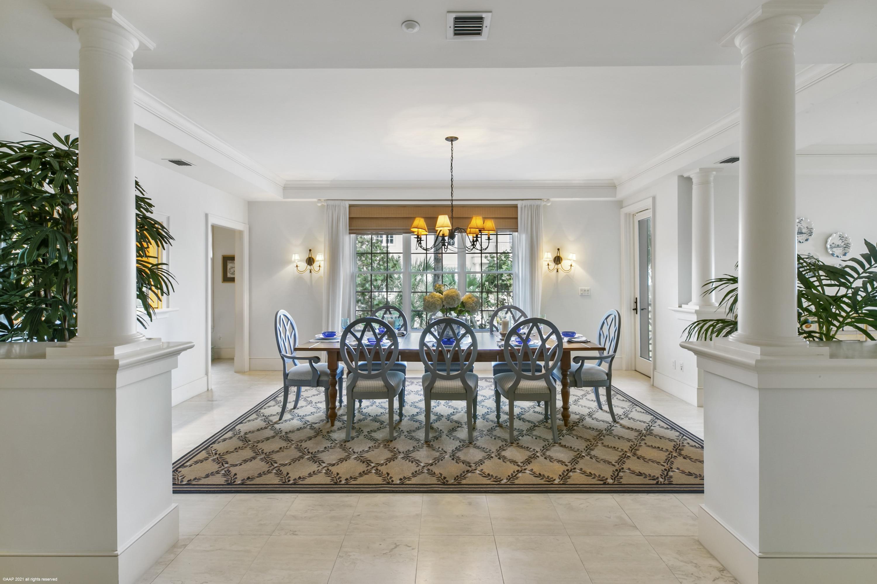 60 Beachside Drive, Unit 201 Orchid, FL 32963 - Photo 5 of 23 a dining room with furniture a rug and a chandelier