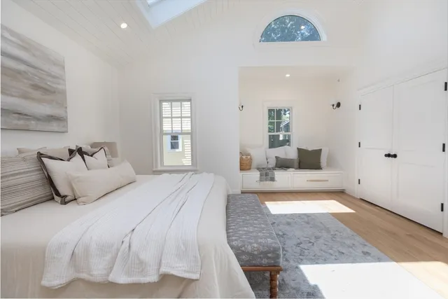 a bedroom with a bed and a couch