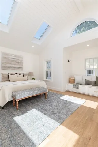 a bedroom with bed and window