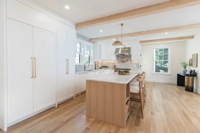 a kitchen with a sink cabinets and window