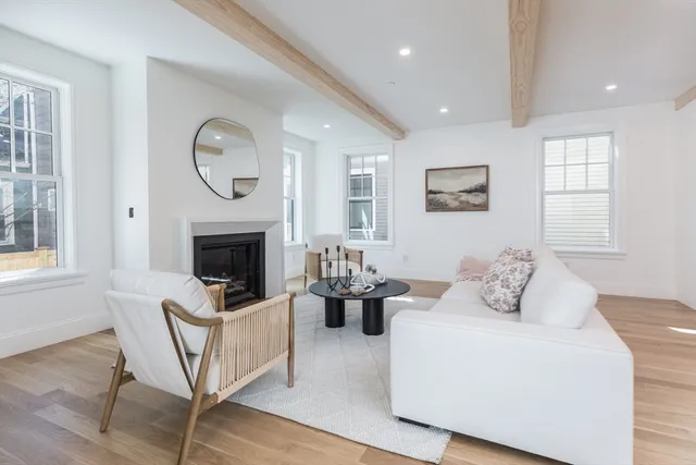 a bedroom with furniture and a fireplace