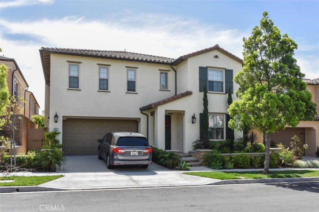 a car parked in front of white house
