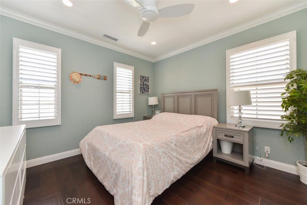 62 Rossmore Irvine, CA 92620 - Photo 14 of 43 a bedroom with a large bed and a large window