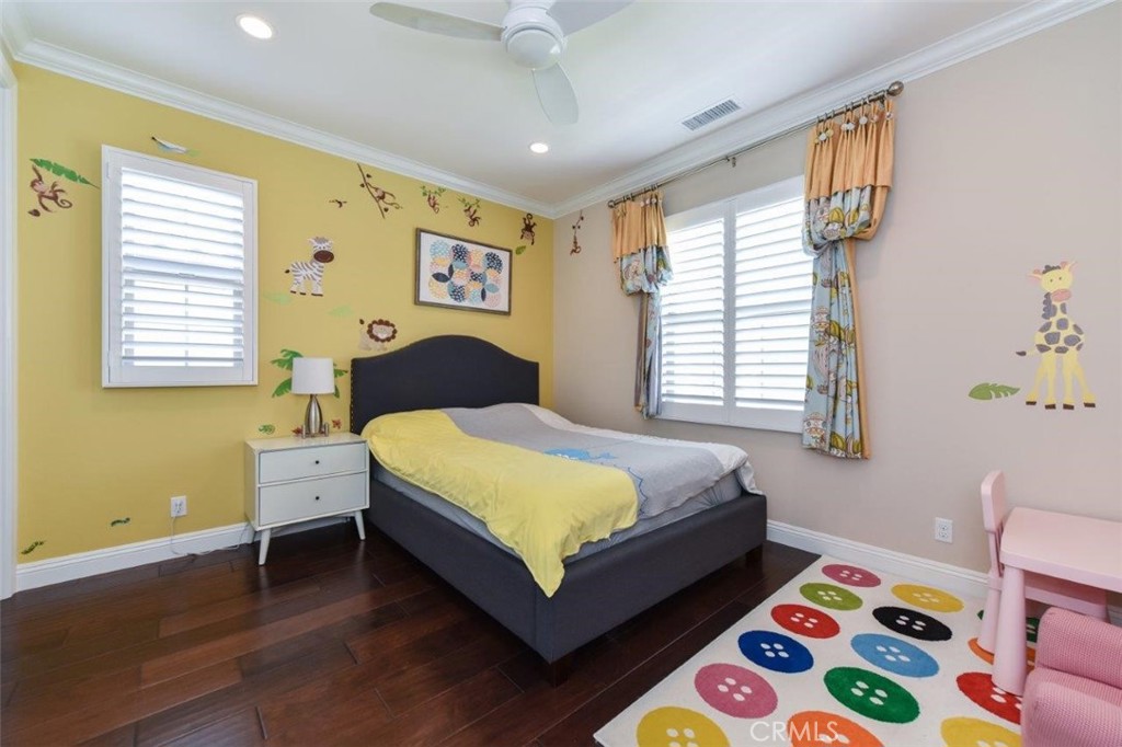 62 Rossmore Irvine, CA 92620 - Photo 15 of 43 a bedroom with a bed and a window