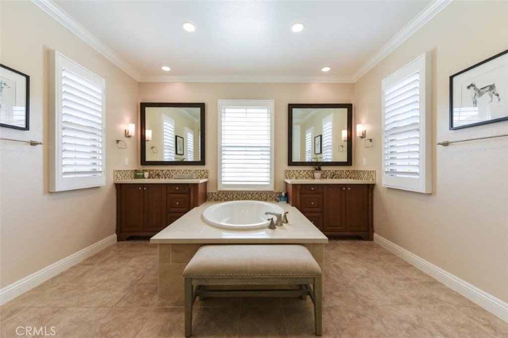 62 Rossmore Irvine, CA 92620 - Photo 21 of 43 a en suite bathroom with a sink double vanity and a mirror