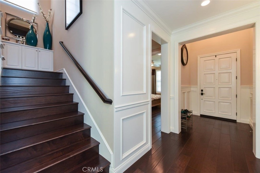 62 Rossmore Irvine, CA 92620 - Photo 23 of 43 a view of entryway and hall with wooden floor
