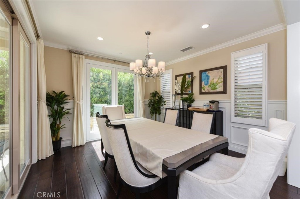 62 Rossmore Irvine, CA 92620 - Photo 32 of 43 a view of a dining room with furniture window and wooden floor