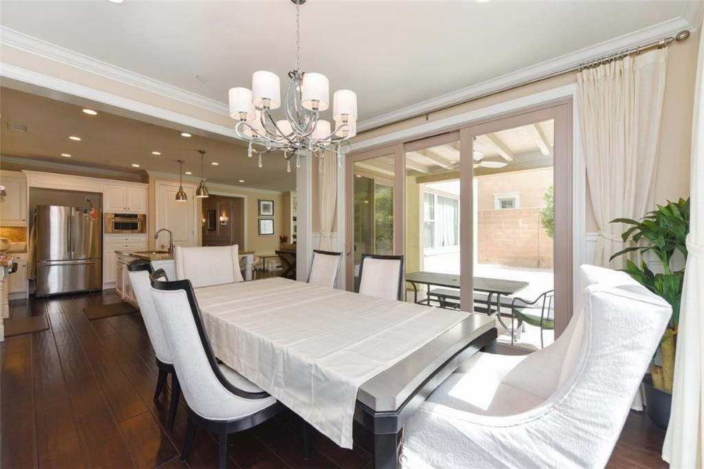 62 Rossmore Irvine, CA 92620 - Photo 33 of 43 a view of a dining room with furniture window and wooden floor
