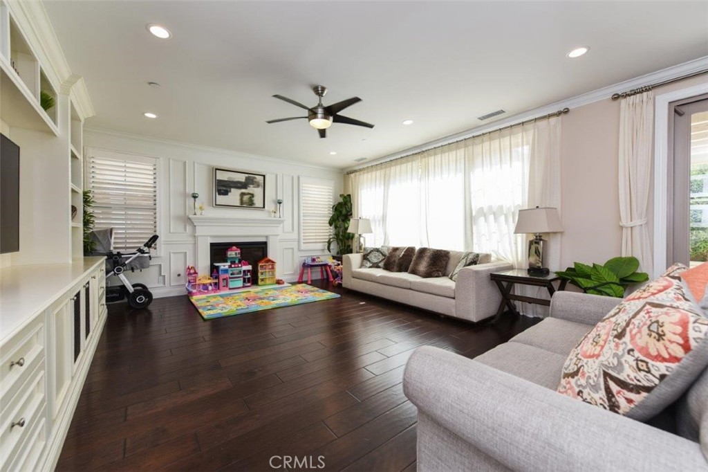 62 Rossmore Irvine, CA 92620 - Photo 9 of 43 a living room with furniture fireplace and a window
