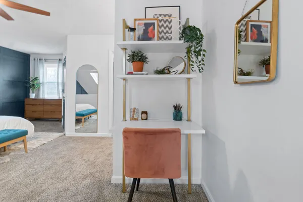 a workspace with furniture and window