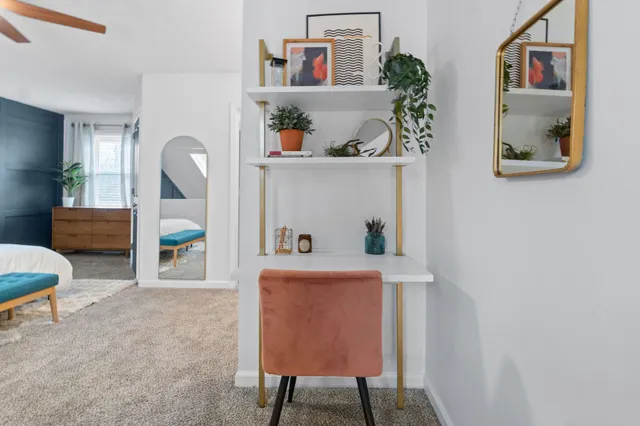 a workspace with furniture and window