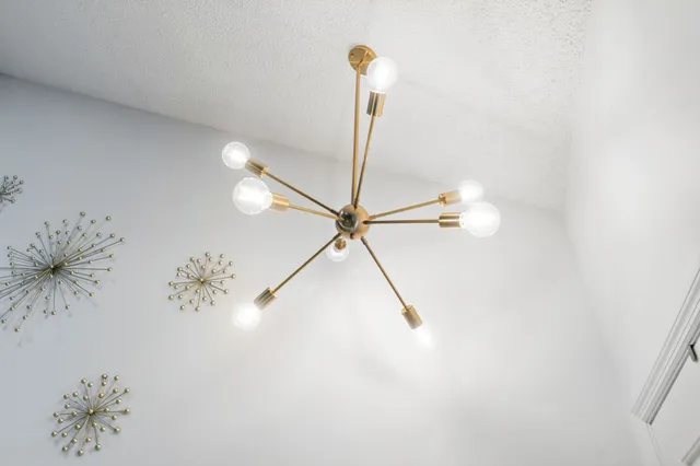 a bathroom with a shower and a ceiling fan