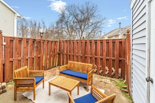 a blue bench sitting in front of a building