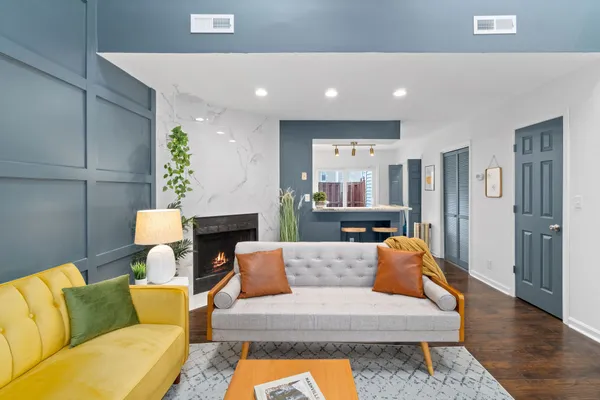 a living room with furniture and a fireplace