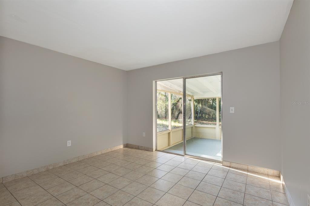 2436 Northland Road Mount Dora, FL 32757 - Photo 12 of 27 an empty room with windows