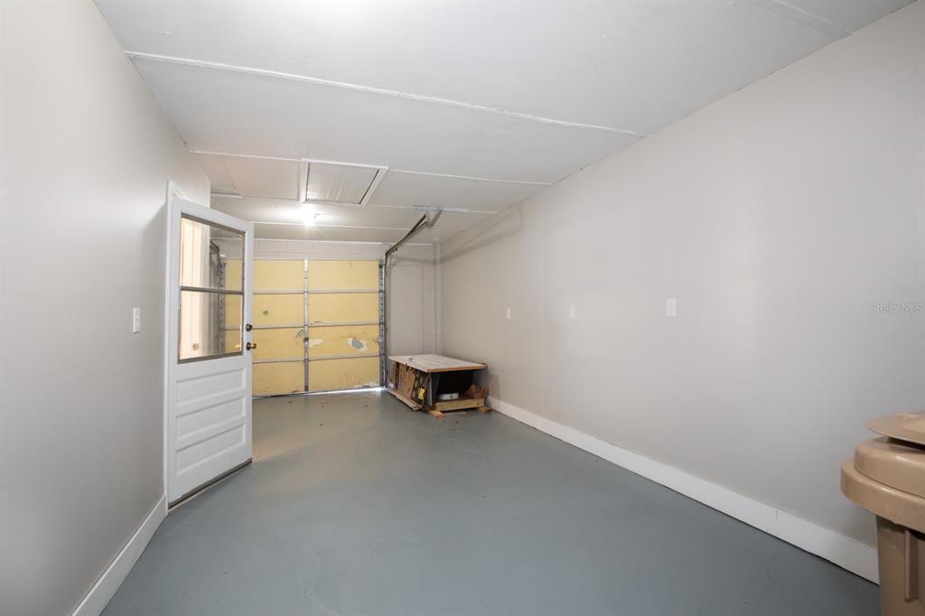 2436 Northland Road Mount Dora, FL 32757 - Photo 20 of 27 a view of a storage & utility room with racks on the wall